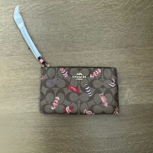 Coach Brown Wristlet with Pink Candy Detailing